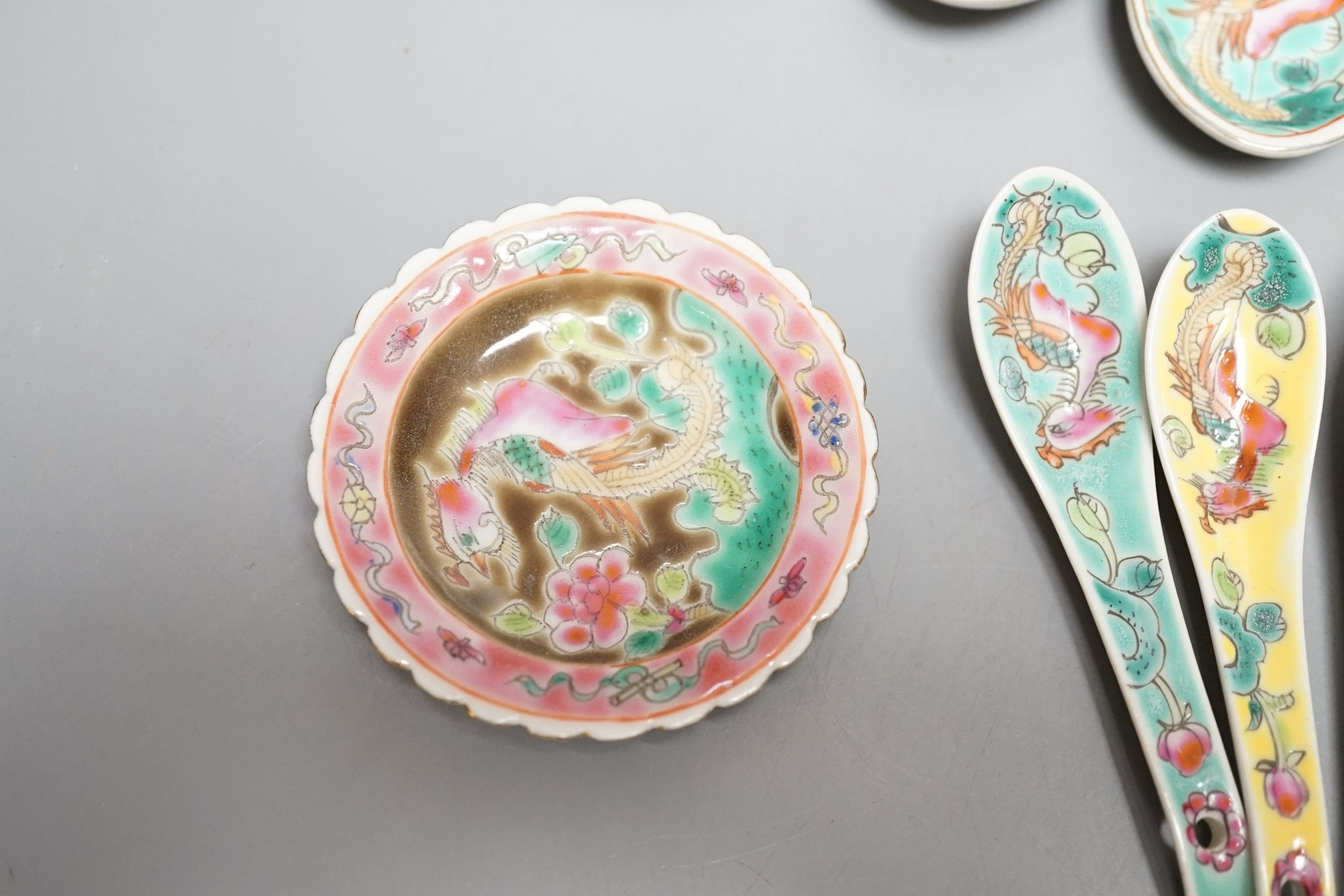 A collection of Chinese Straits porcelain spoons and a dish